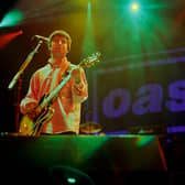 Noel Gallagher of Oasis performs on stage. Photo: Stacia Timonere/Getty Images