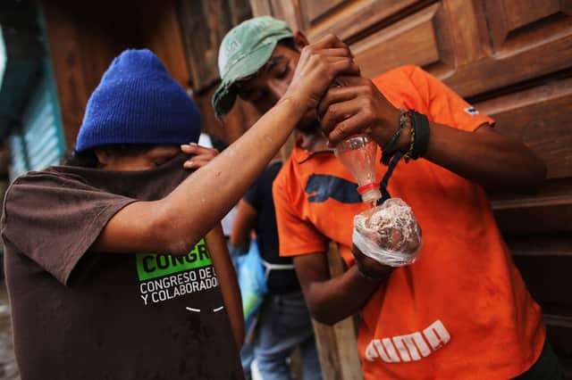 Teens living on the street sniff paint thinner. Photo: Spencer Platt/Getty Images