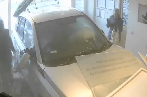 The moment former police officer William McBurnie crashes into a funeral home in an attempt to murder his ex-partner