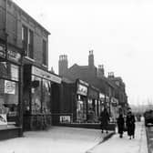 Shops on Austhorpe Road in October 1938.. In focus are John Crockatt, dyers and cleaners number 16, William Taylor Thompson, grocers at number 14, Isaac Stephenson, butcher at number 12D, Gladys Walton, greengrocer number 12C, Meadow Dairy number 12B and Taylors Chemist at number 12A. 