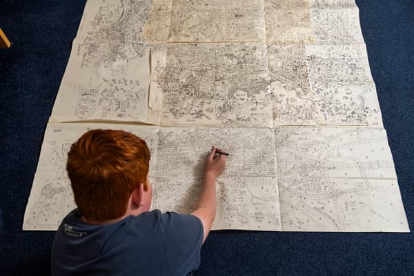 Jake Daniels-Shipsmith with his incredible city map which he has been working on for seven years. 
