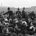 Police among the crowds on Holbeck Moor.