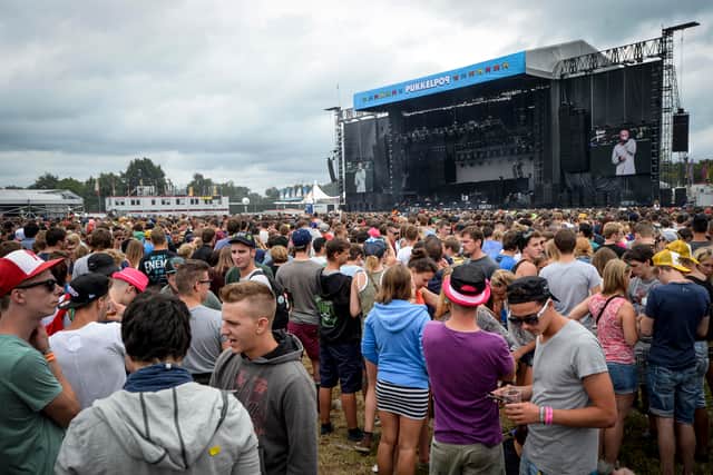 People gather for a concert on the first day of the three-day Pukkelpop music festival in Hasselt, North -Eastern Belgium on August 15, 2013.