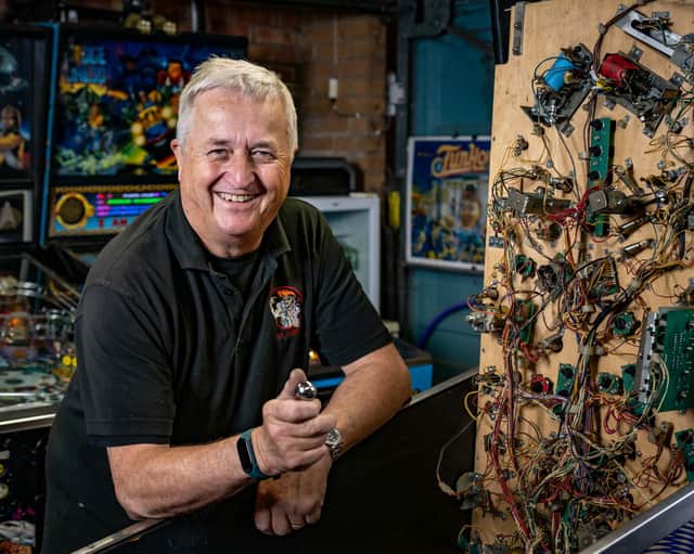 Dr Pinball Mark Squires at his home in Swavesey, Cambridgeshire where he fixes and restores pinball machines.