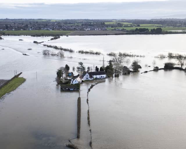 Dramatic aerial pictures showed the four-bedroom detached house circled by rising flood water after the River Severn burst its banks earlier this year.