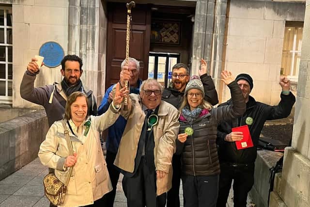 David Blackburn (centre) celebrates with other Green Party members after re-taking the Farnley and Wortley seat in a by-election