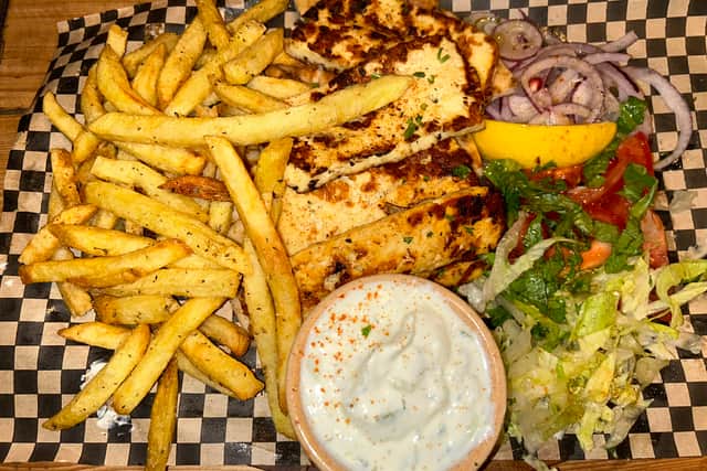 The hearty halloumi board with oregano chips, pita, tzatziki and a side salad