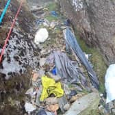 Video grab from heartbreaking footage showing 'waterfalls' of 3,000 bits of rubbish including drinks cans and Santa hats left by people on Mount Snowdon.