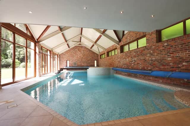The indoor swimming pool also has a hot tub