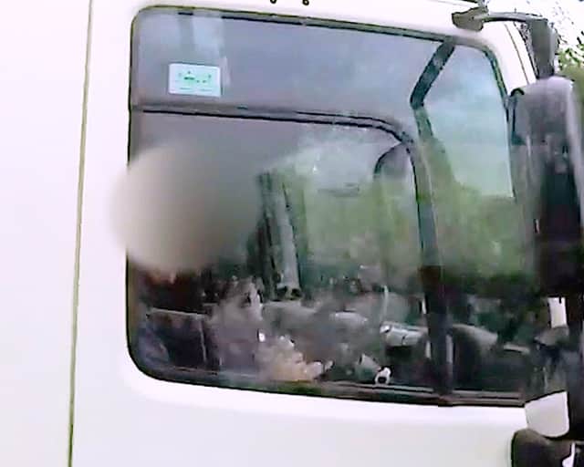 Shocking footage shows HGV driver caught eating yoghurt at the wheel