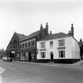 The junction of Cherry Row with Lincoln Road in August 1958. This part of Burmantofts was also known as Newtown. At the very left edge is Lincoln Field Row, then, with advertising on the side of the end property, is Lincoln Street. The building with the arched doors and windows is the old Lincoln Fields Wesleyan Methodist Sunday School, at number 6 Hill Street, located at the junction with Cherry Row and Hill Street.