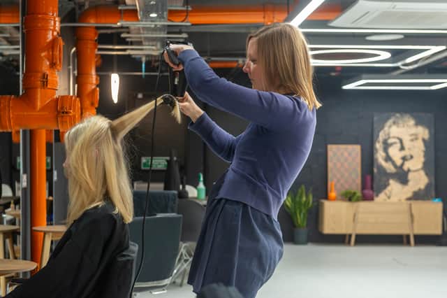 A new salon has opened in Leeds today (November 12). Pictured is stylist Nancy Baxter preparing for the grand opening of Gareth Vance Salon in the corner of Ludgate Hill and Harewood Street. Photo: Lizzie Coombes