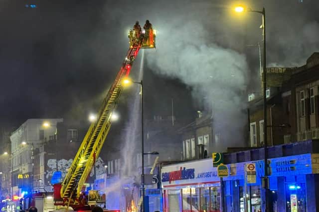 London Fire Brigade tackle a fire at a takeaway in Holloway.