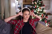 Woman listening to Christmas music.
