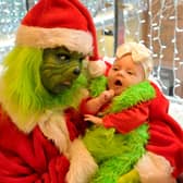 Two-month-old Minnie McCulloch from Middleton says hello to the Christmas Grouch.