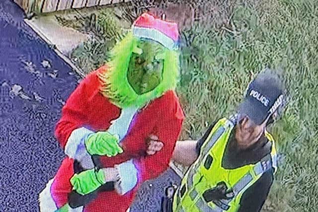 A caretaker dressed as the Grinch has been "arrested" by police - in a stunt to give nursery kids ''closure'' after a break-in.