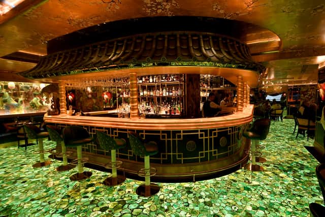Diners at the Ivy Asia are promised showstopping decor lit by this electric green flooring.