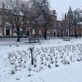 Empty benches in Park Square, as the garden was completely covered with snow.