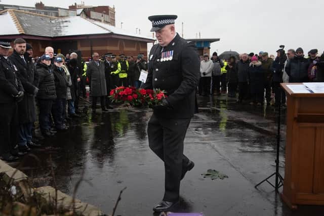 Paying respects at the Gynn Square memorial service to officers who died in the 1983 rescue mission