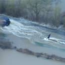 Man wakeboards along flooded road in Leicestershire.