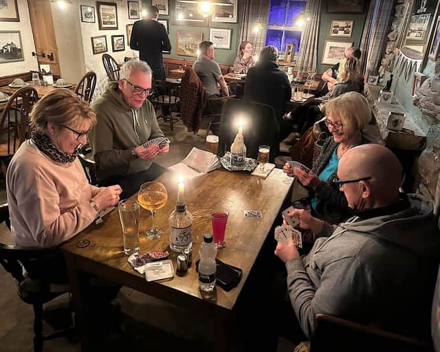 Snowed-in visitors at the The Tan Hill Inn, in North Yorkshire, tuck into an English breakfast on Monday morning