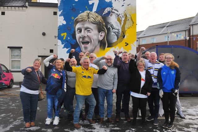Leeds United fans by the new Gordan Stranchan mural at The Holbeck
