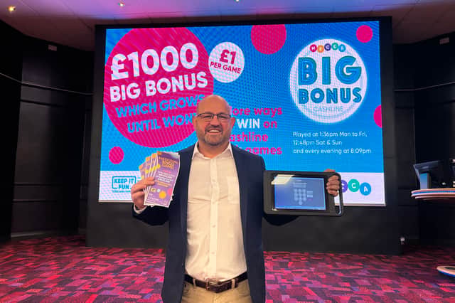 Mel Kassim, general manager, Mecca Bingo Wakefield, celebrates the announcement of another £50k winner at his club.