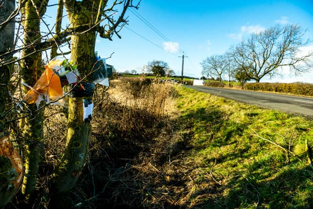Tributes at the scene of the fatal crash on Bramley Lane between West Bretton and Woolley, Wakefield.
