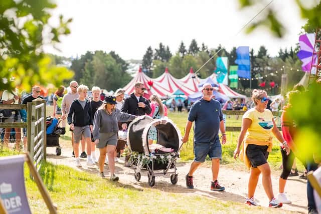Families make their way through Alex James' farm at the 2024 edition of The Big Feastival.