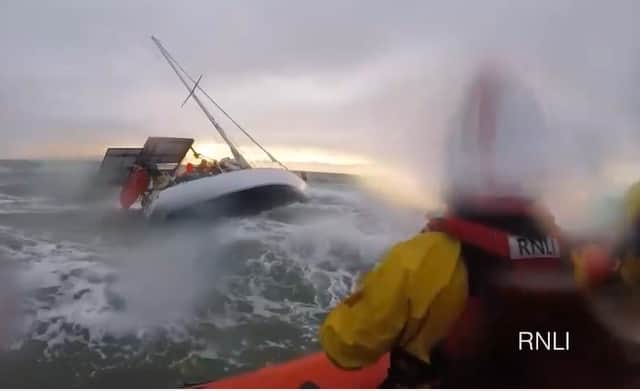 RNLI preparing to rescue passengers on a yacht
