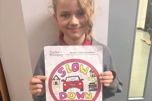 Alice with her creative speed awareness sign.