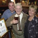 Enjoy these photo memories of pubs we have loved and lost in Pudsey and Stanningley. Pictured is Tommy Spurr standing in the same place as he had done for the last 72 years in October 2003 at the now-closed White Cross with landlord Colm and Sue O'Neill.