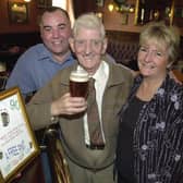 Enjoy these photo memories of pubs we have loved and lost in Pudsey and Stanningley. Pictured is Tommy Spurr standing in the same place as he had done for the last 72 years in October 2003 at the now-closed White Cross with landlord Colm and Sue O'Neill.