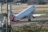 Tail of British Airways jet hits runway during aborted landing.