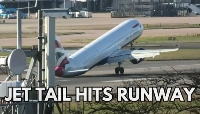 The tail of a plane hitting the ground while trying to land