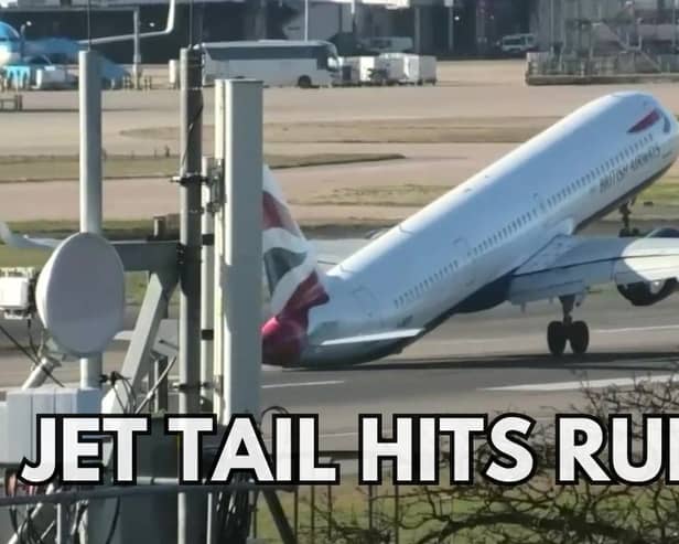 The tail of a plane hitting the ground while trying to land