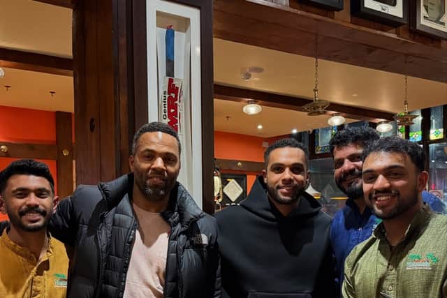 Ray Fearon and Lucien Laviscount with staff from Tharavadu