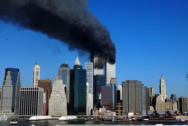 The twin towers of the World Trade Centre billow smoke after hijacked airliners crashed into them on 11 September 2001. 