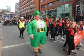 A costume clad parade goer.
