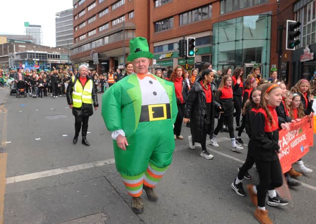 A costume clad parade goer.