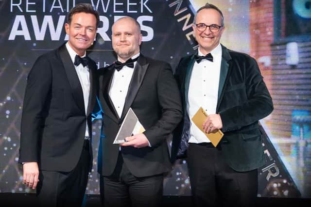 David Brook collecting his award from TV personality Stephen Mulhern