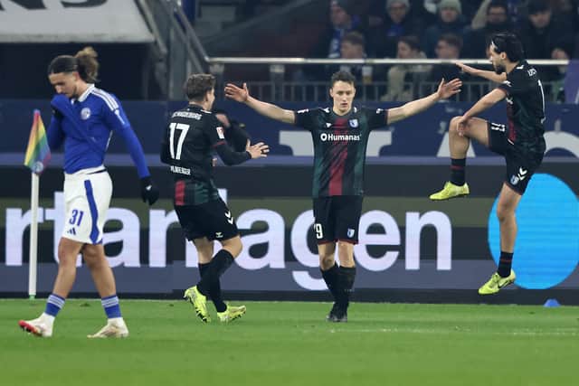 Martijn Kaars [second from right] celebrates scoring versus Schalke 04