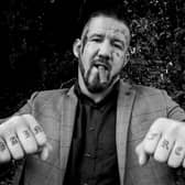 Bare knuckle fighter poses for photograph