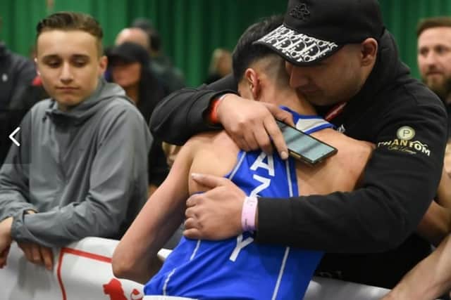 Azaan embracing his dad Nazeem after his victory in the England Boxing National Junior Championships over the weekend