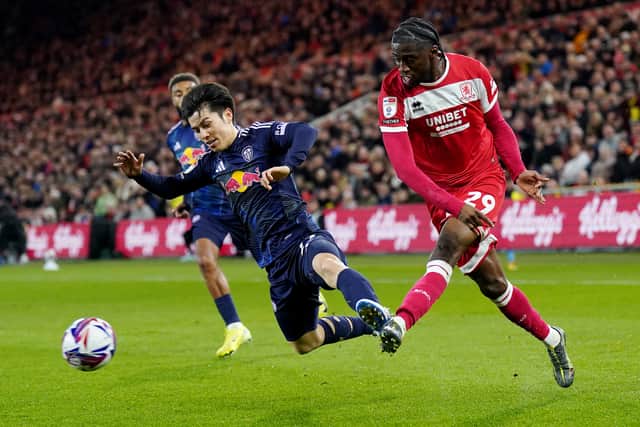 Leeds United's Ao Tanaka (left) and Middlesbrough's Samuel Iling-Junior battle for the ball during the Sky Bet Championship match at the Riverside Stadium, Middlesbrough.  Owen Humphreys/PA Wire.
