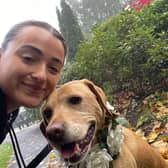 Rebecca McBride, chaperoning a dog.