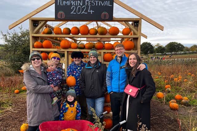 David Norman pumpkin picking with family in October 2024 (L to R - Rhiannon, Emrys, Siân, Idris, David, Adam, Rhys and Chloe). 