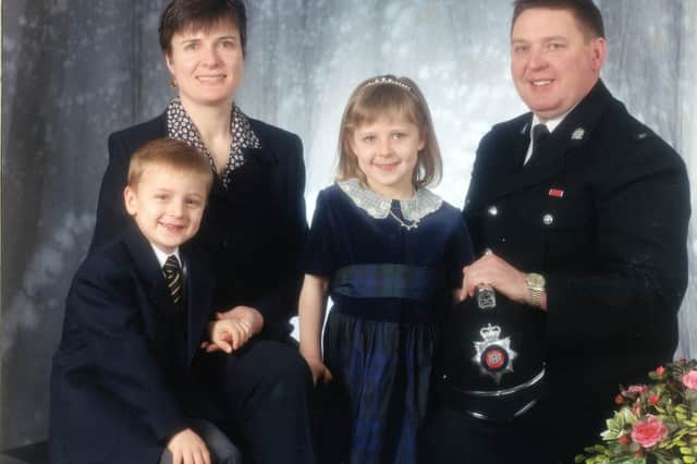 A family photograph from when David received his MBE. 