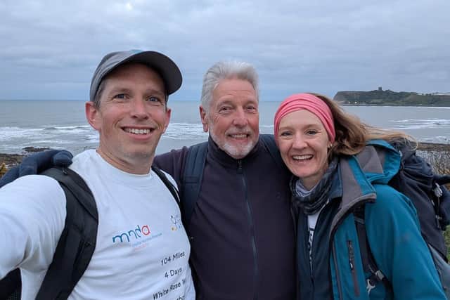 Gareth Brown with his dad, Paul, and partner, Becky, as they completed the final stretch to Scarborough.