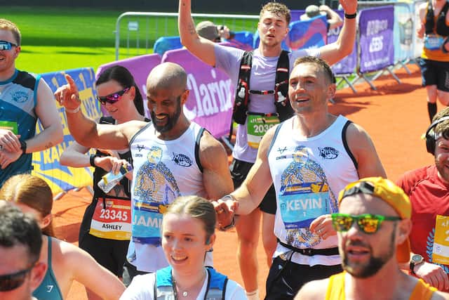 Jamie Jones-Buchanan and Kevin Sinfield reach the finish line.